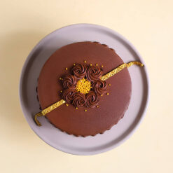 Golden Rakhi Truffle Cake With Chocolate Swirls