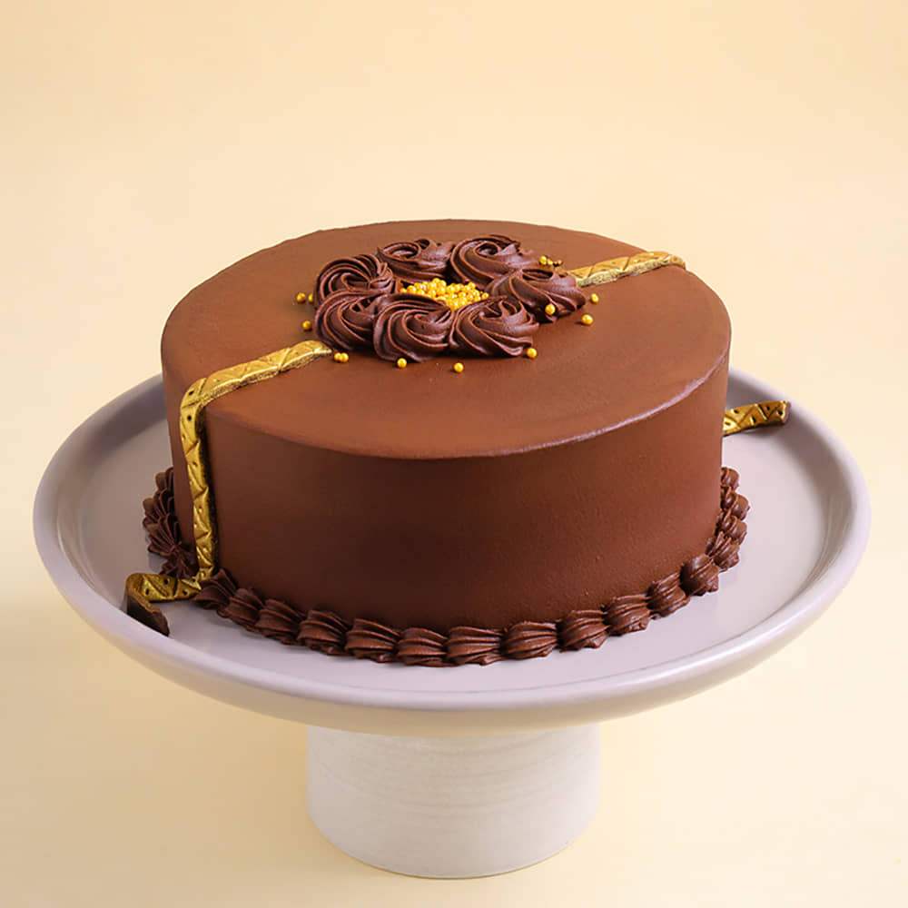 Golden Rakhi Truffle Cake With Chocolate Swirls