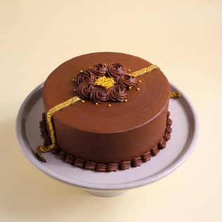 Golden Rakhi Truffle Cake With Chocolate Swirls